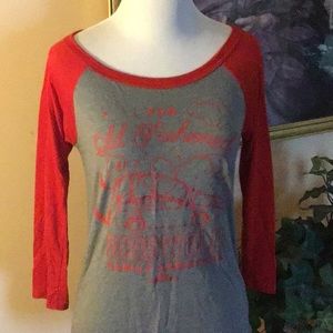 Never worn without tags Baseball style three-quarter length, sleeve shirt